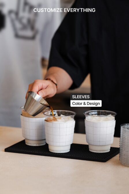 Barista pouring espresso into cup with grid-pattern sleeve mockup, three cups displayed