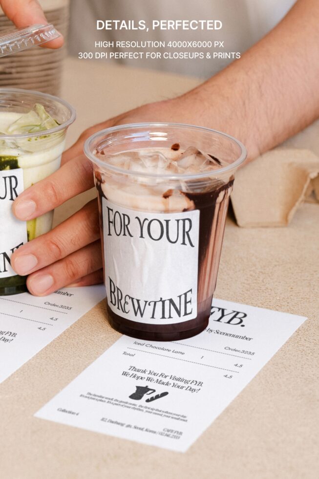 Hand holding cold drink cup with label mockup on white receipt
