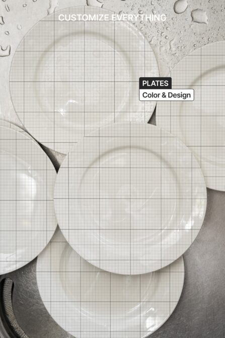 Overhead shot of three white ceramic plates on textured beige surface with grid overlay