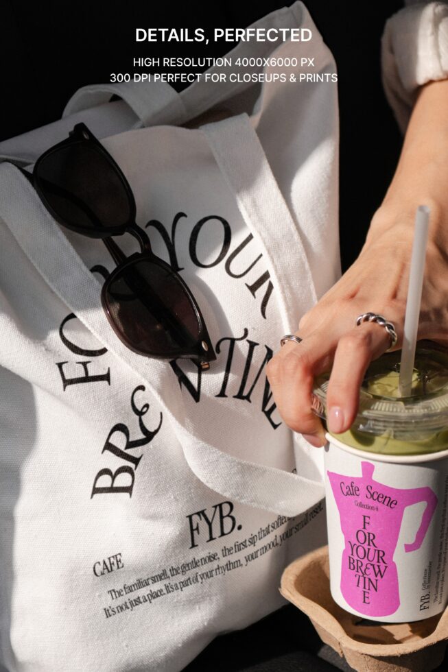 Styled flat lay with tote bag sunglasses pink coffee mug with matching branding on dark surface