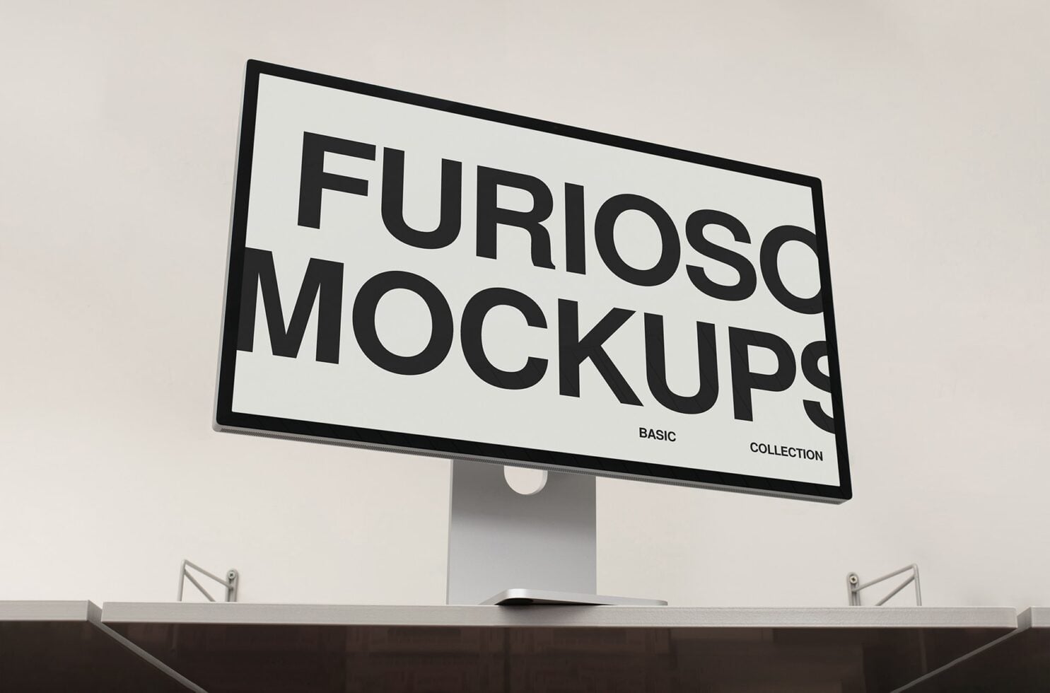Desktop monitor on stand displaying Furioso Mockups Basic Collection branding