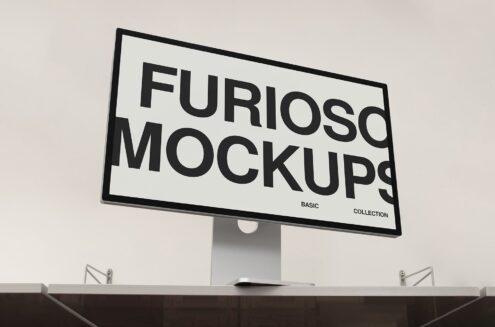 Desktop monitor on stand displaying Furioso Mockups Basic Collection branding
