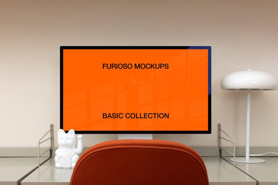 Desktop monitor displaying orange screen with modern office setup