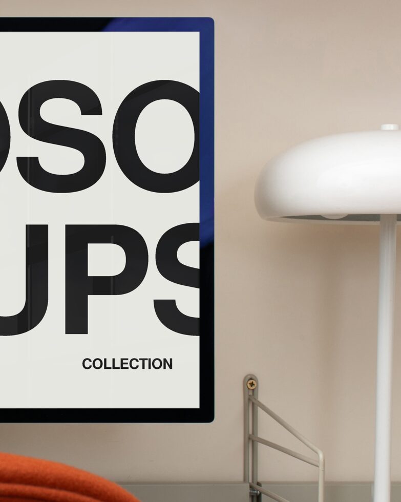 Framed poster with blue border showing large black typography