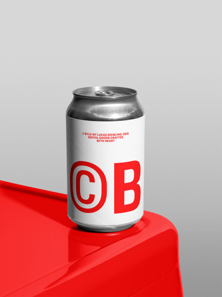 White aluminum can with red letters on red block, light background