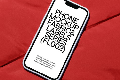 Smartphone screen on crimson fabric with diagonal quilted texture detail