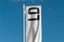 White horizontal banner with black logo symbol, digital goods credit text below