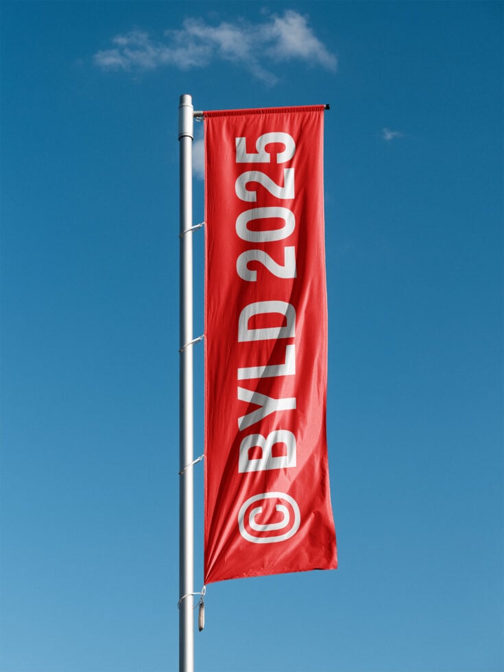 Red horizontal banner flag with white numbers, mounted on metal pole against cloudy sky