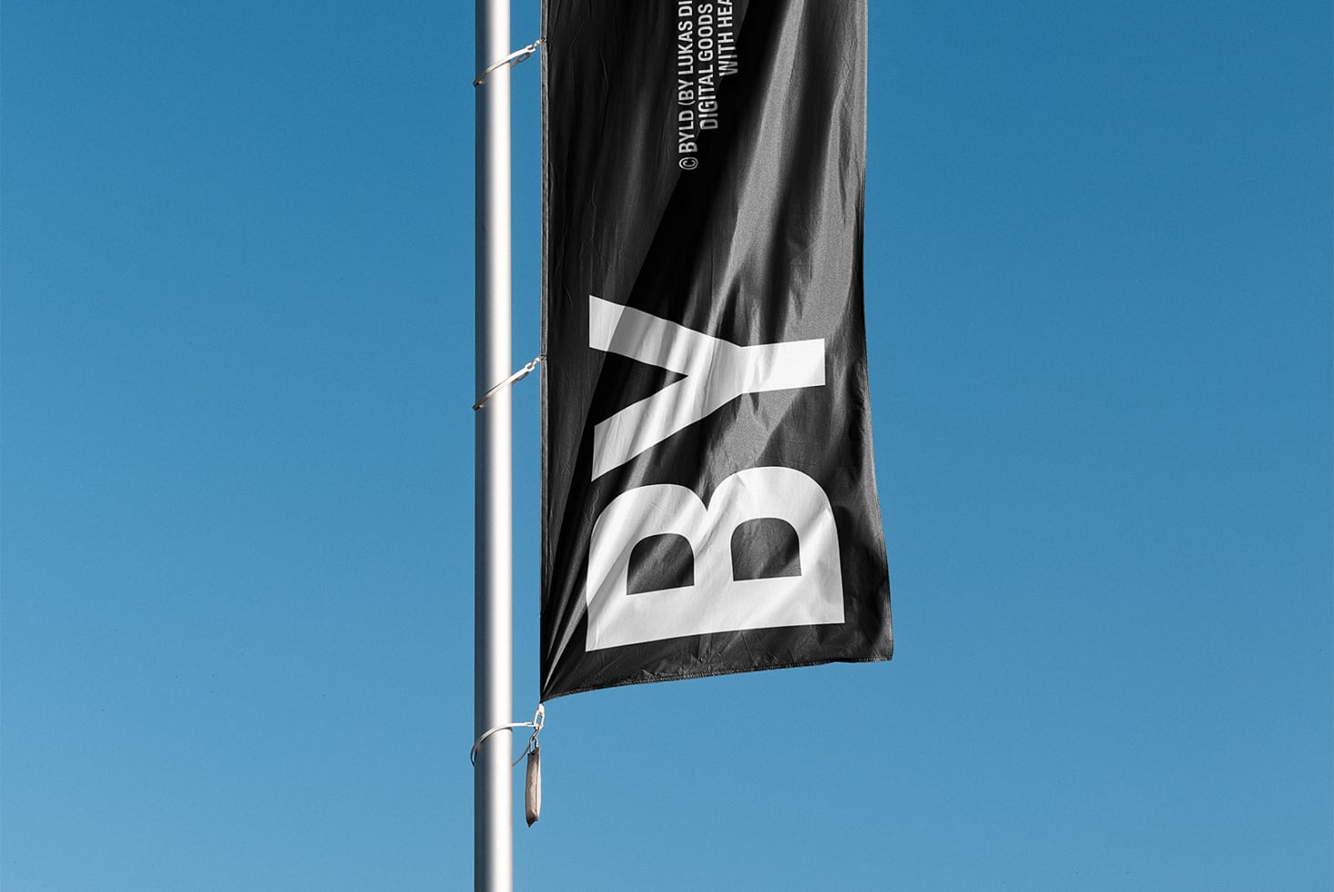 Dark grey banner flag with white logo symbol, digital goods credit text fluttering