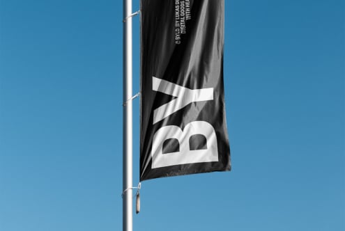 Dark grey banner flag with white logo symbol, digital goods credit text fluttering