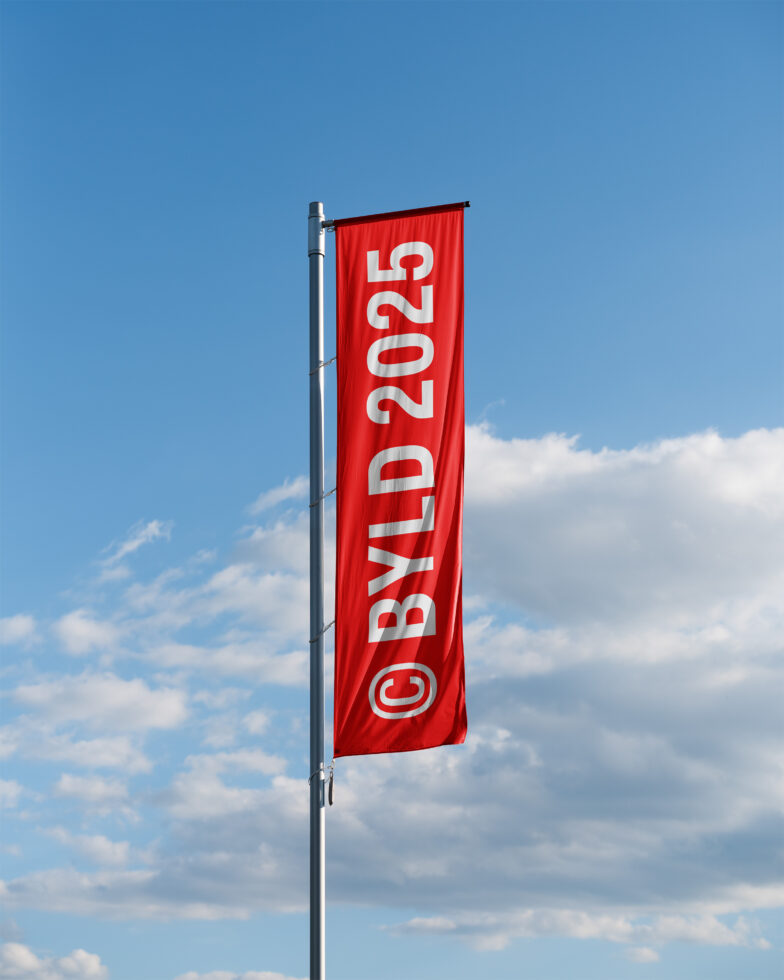 Red vertical banner flag with white numbers, mounted on metal pole against cloudy sky