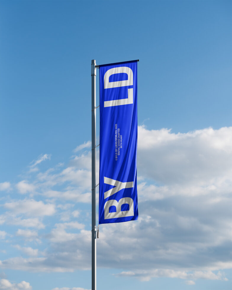 Blue banner flag on metal pole against blue sky with white clouds