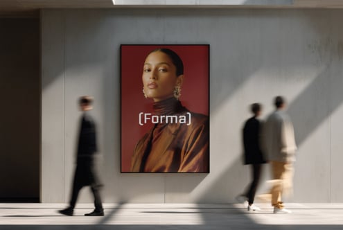 Portrait framed on gallery wall showing woman with red background