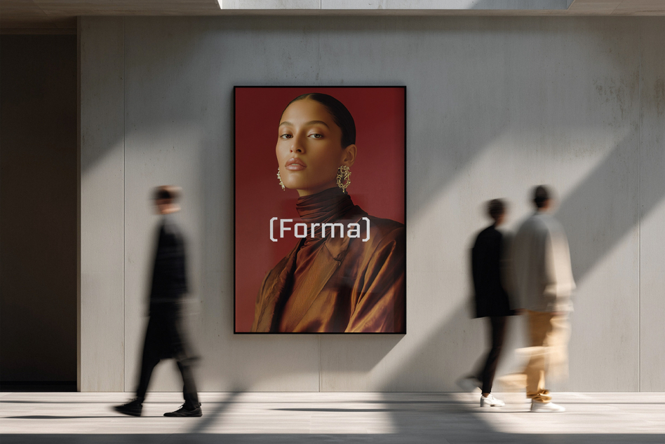 Portrait framed on gallery wall showing woman with red background