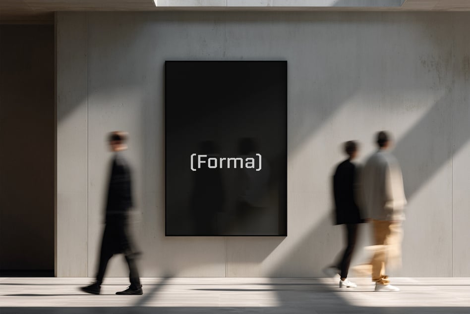Black framed poster on white wall with blurred people walking past in sunlight