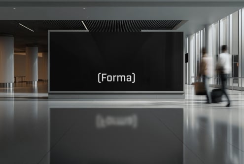 Contemporary gallery space with Forma logo mounted on dark display wall
