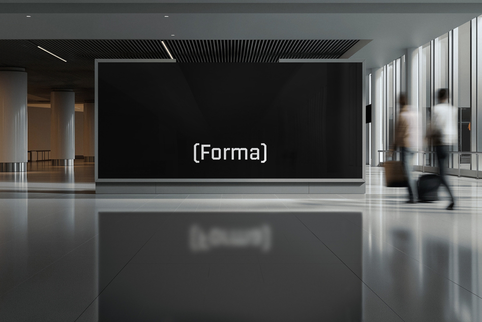 Contemporary gallery space with Forma logo mounted on dark display wall