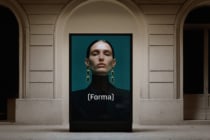 Portrait display with woman wearing statement gold drop earrings in classical gallery