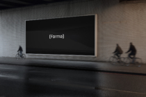 Horizontal billboard with black screen showing (Forma) in white letters