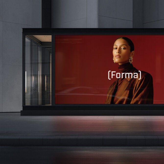 Storefront display with woman portrait on red backdrop, glass entrance door visible