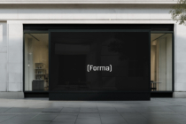 Interior corridor display showing minimalist text logo on dark screen
