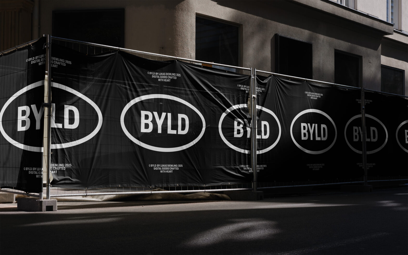 Black construction banner with repeating white BYLD oval logo circles
