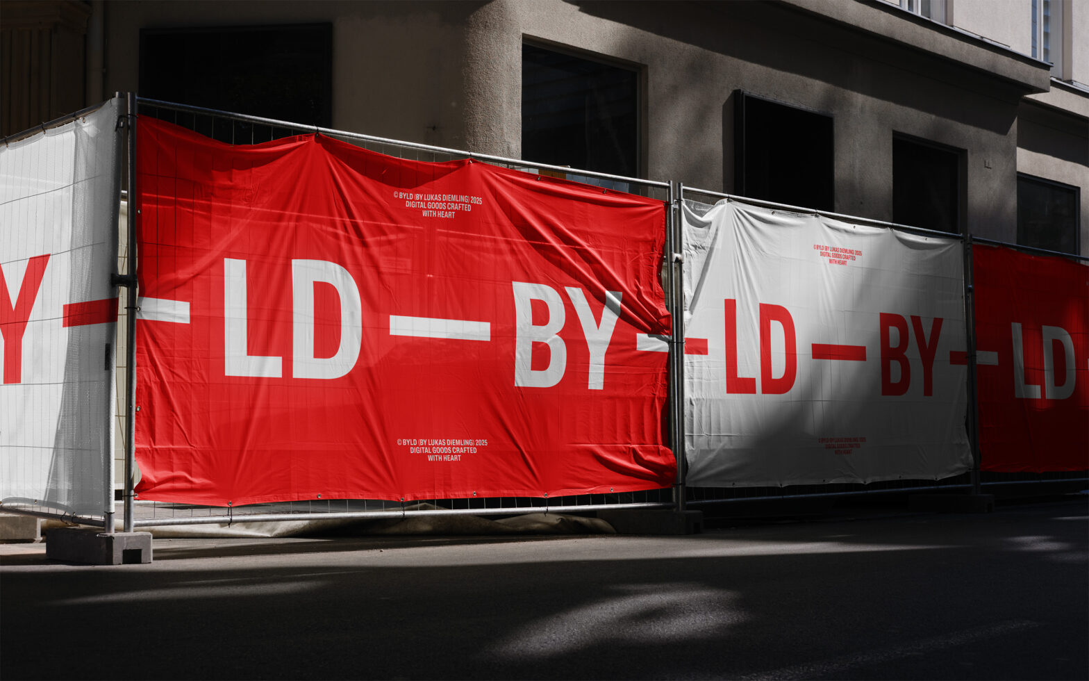 Split red white construction banner showing BYLD BY LD text breakdown