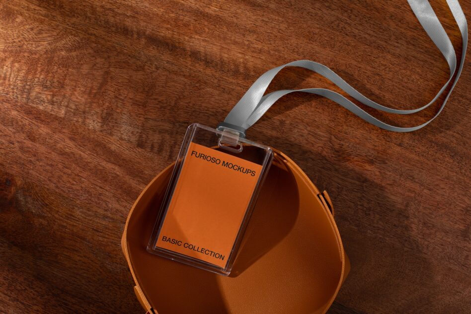 Clear badge mockup with orange interior on leather pouch with ribbon