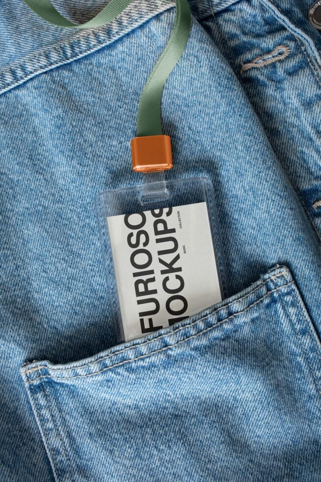 ID badge on denim with green strap, orange clip, white label mockup