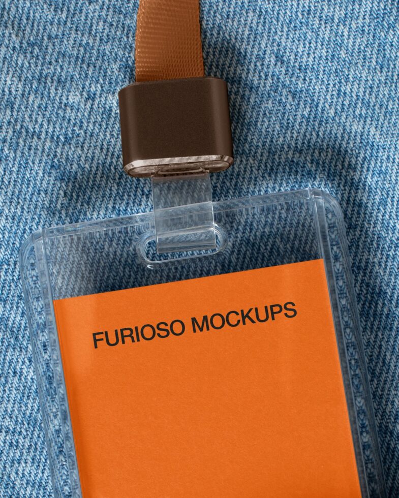 Clear ID badge with orange label reading Furioso Mockups on blue textured fabric background