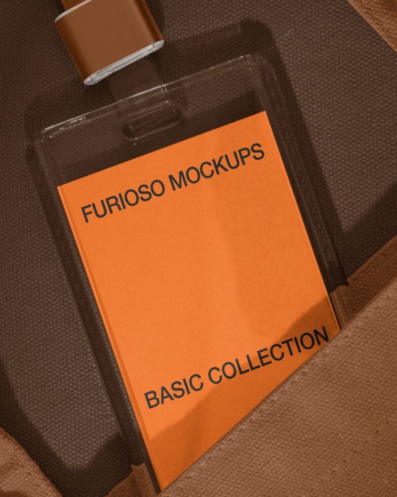 Clear acrylic product package with orange label on woven brown textile background