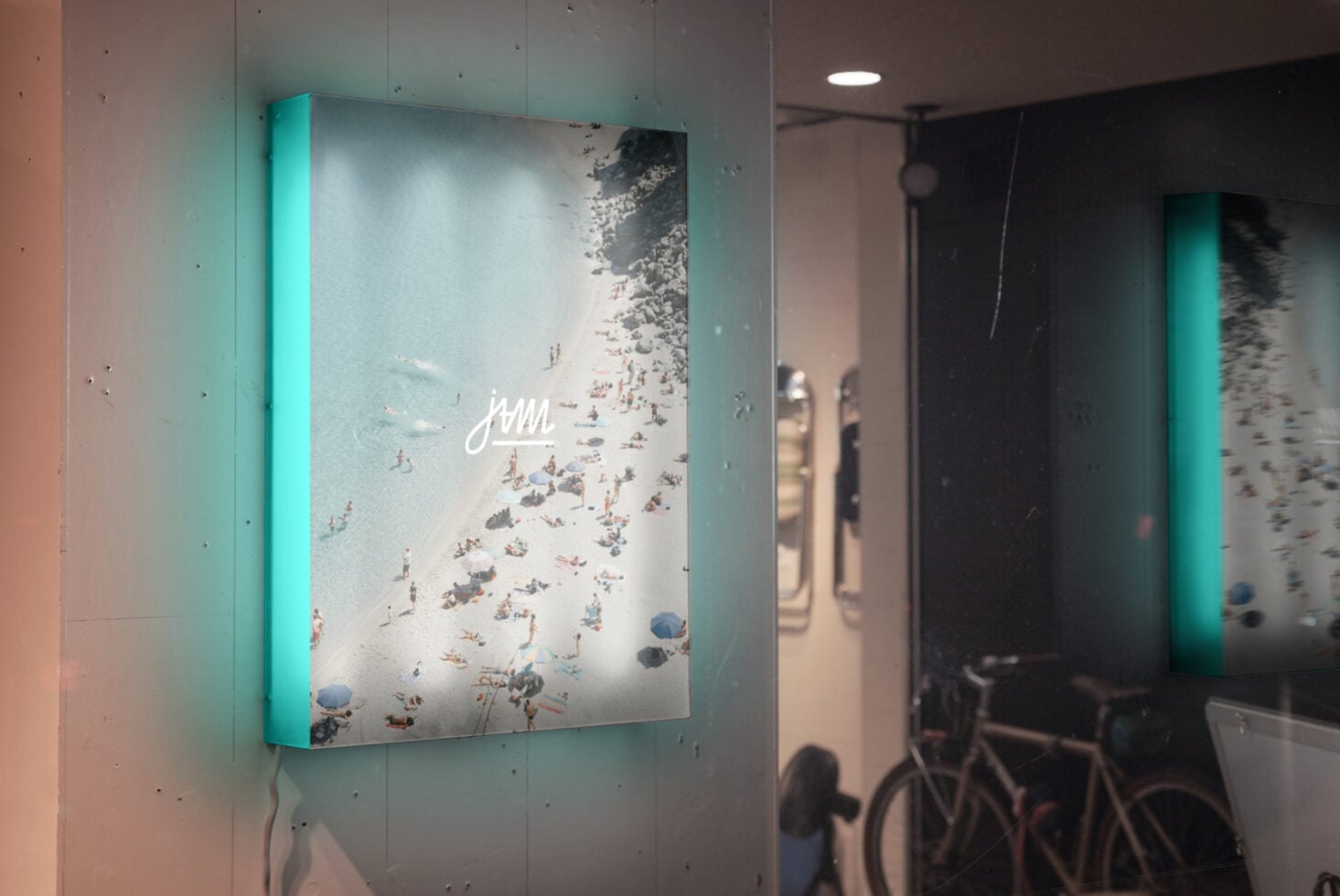 Backlit lightbox showing aerial beach photography with cyan neon edge glow