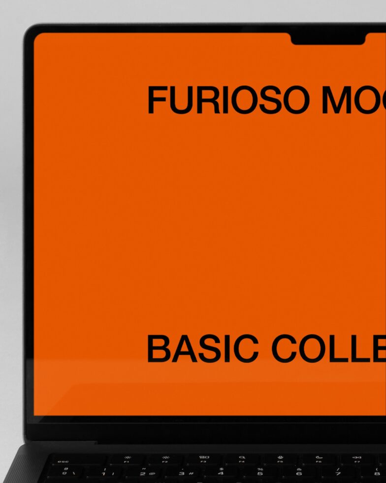 Laptop screen close up showing orange mockup template on display