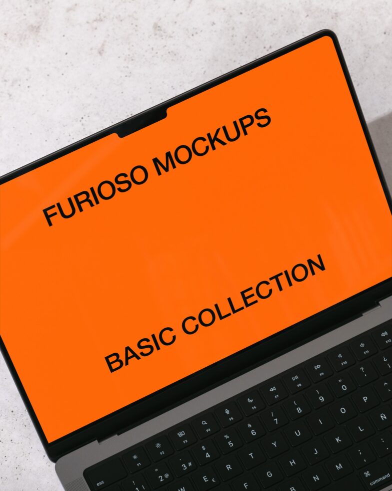 Laptop screen displaying orange mockup with Furioso Mockups Basic Collection text