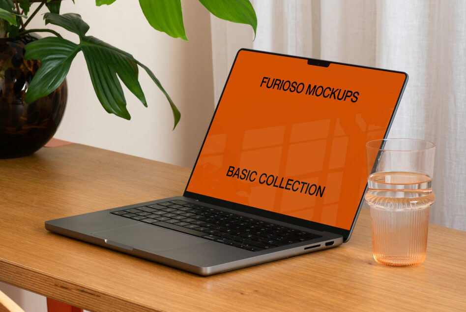 Laptop screen showing orange background with Furioso Mockups Basic Collection text