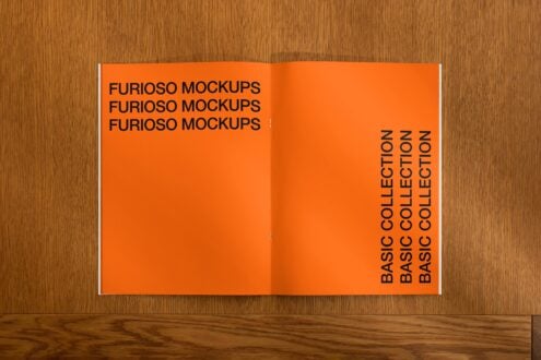 Open orange magazine spread on wood with left page title text layout