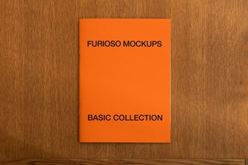 Bright orange square mockup on wooden surface showing basic collection branding