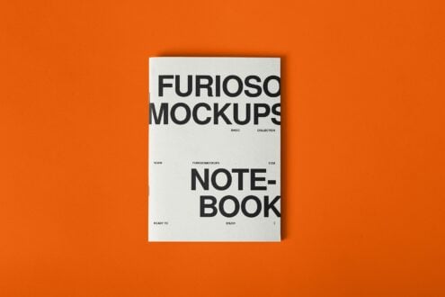 Notebook mockup with bold sans-serif typography on orange background