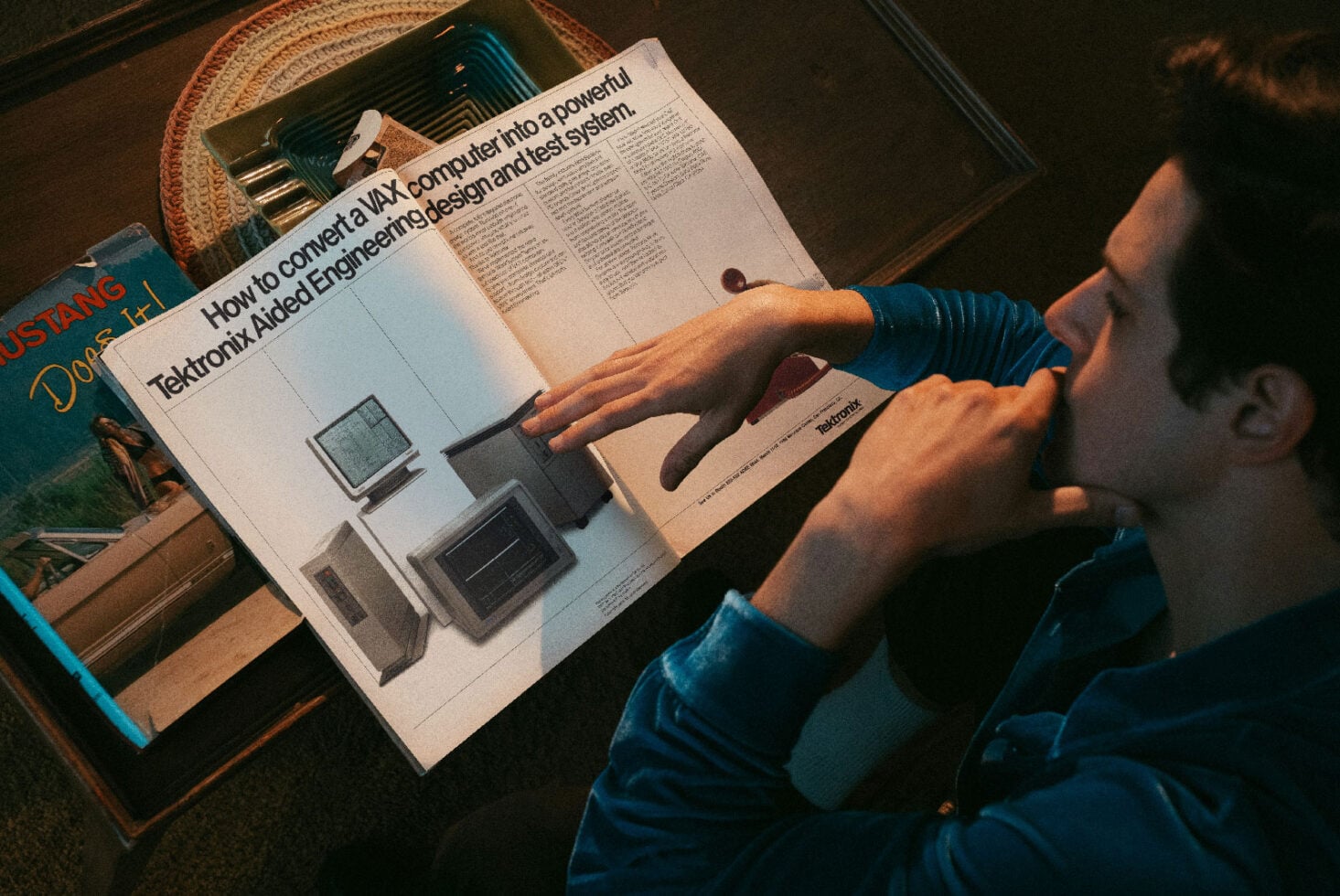 Vintage magazine spread showing retro computer systems with person pointing