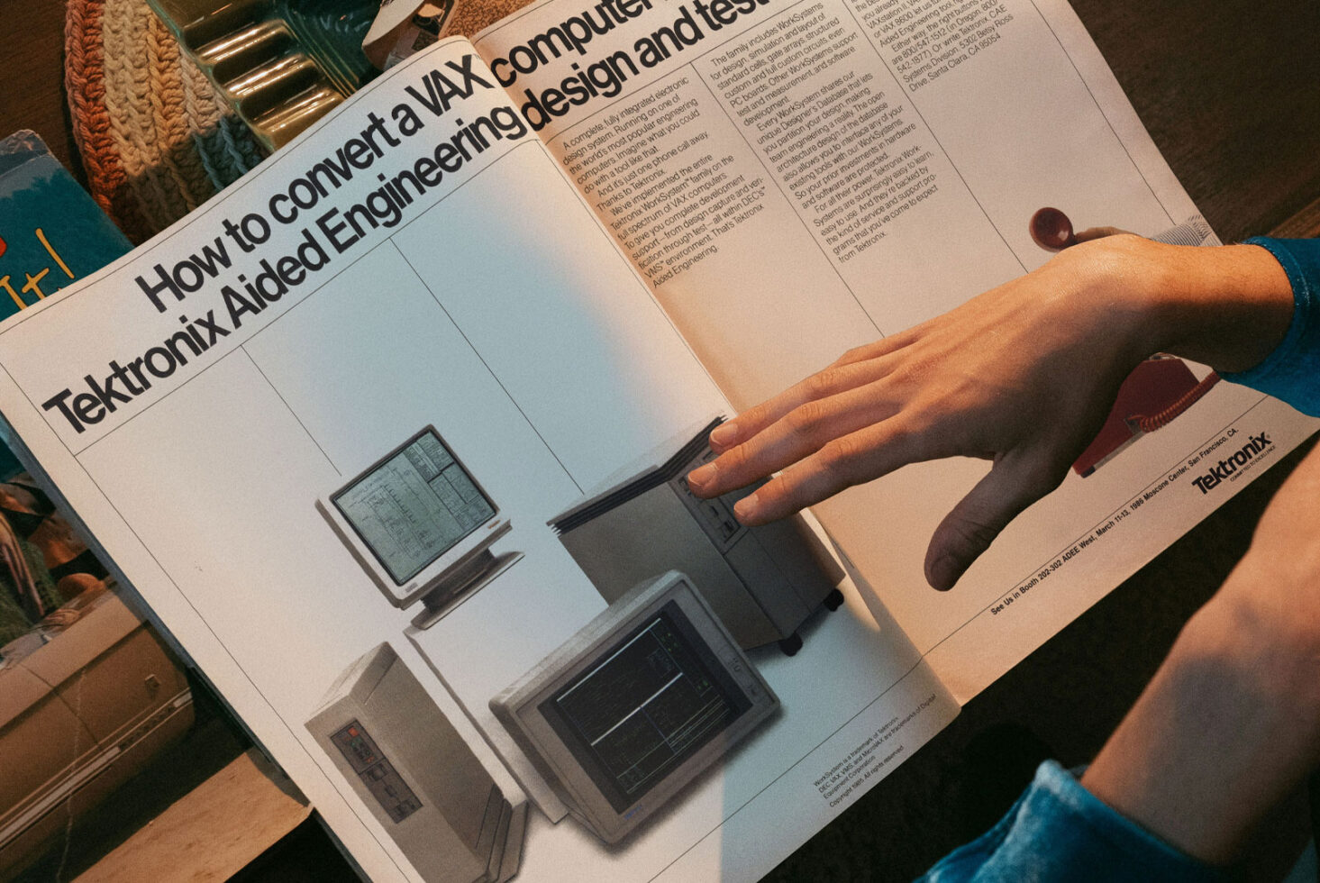 Vintage magazine spread showing retro computer systems with person pointing