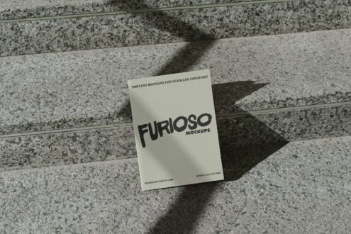 Cream colored card mockup with black Furioso lettering on concrete steps