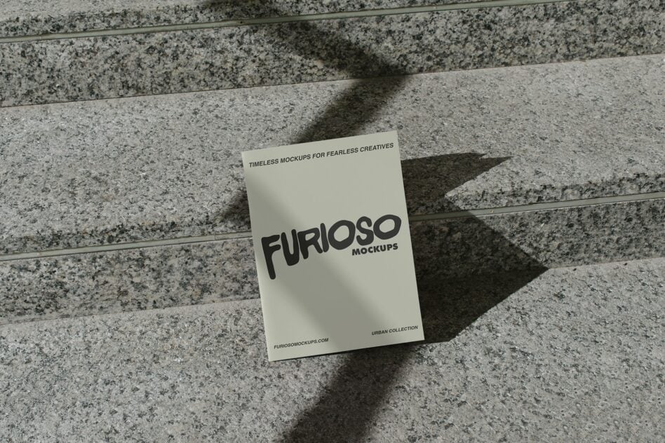 Cream colored card mockup with black Furioso lettering on concrete steps