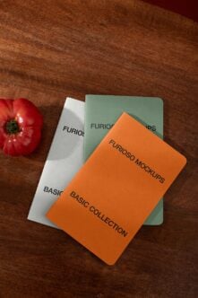 Three rounded cards stacked on wood with red tomato, orange card has black text Furioso Mockups Basic Collection