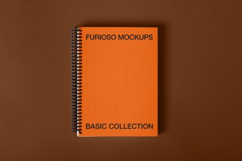 Orange spiral notebook cover mockup on brown background with minimal shadow