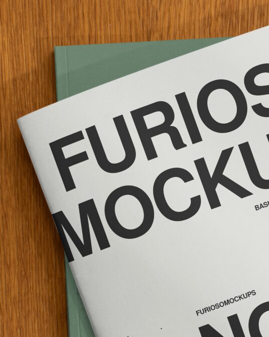 Magazine spread showing large bold type on wooden texture background