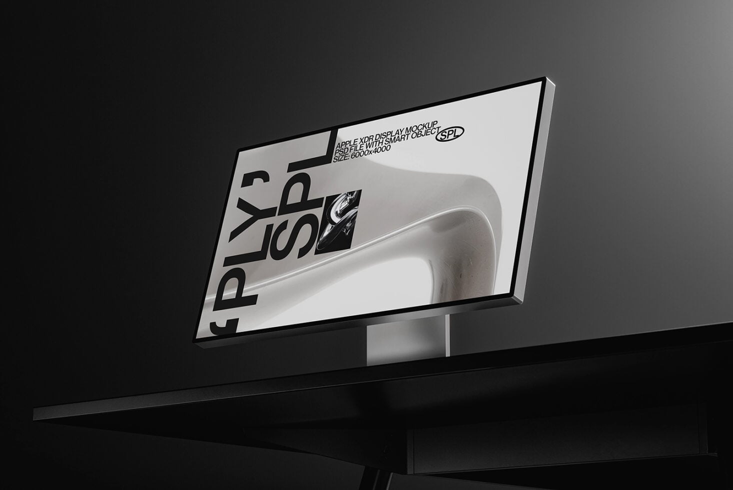 Monitor displaying minimalist product mockup with metallic object on screen