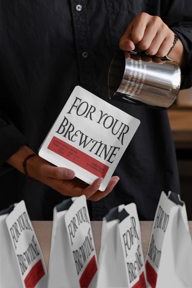 Hand holding coffee bag with red label, pouring from metal pitcher into white cup holder