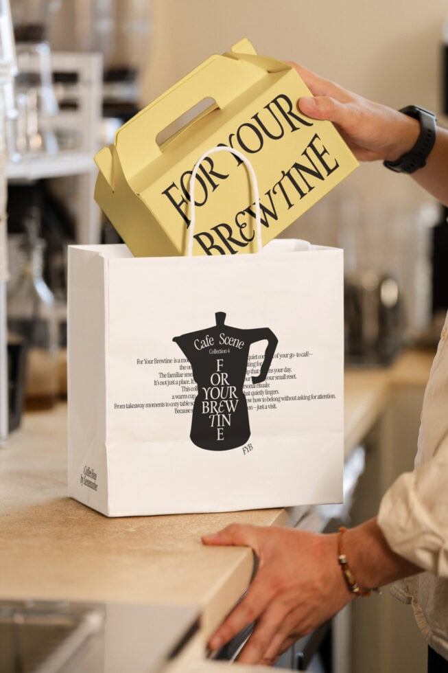 White paper bag mockup with yellow coffee cup inside, branding