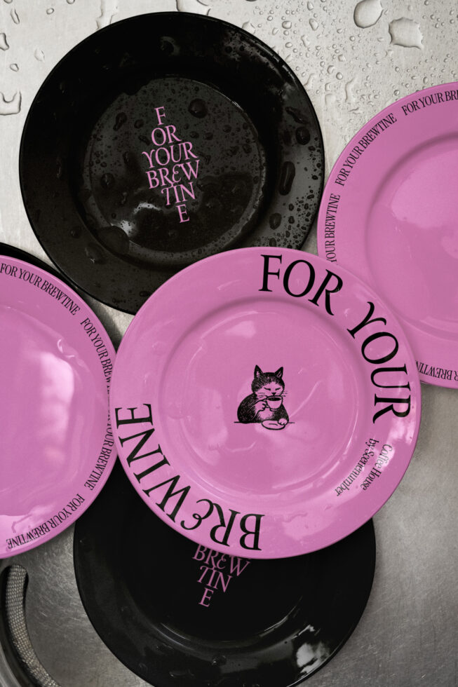 Pink dinnerware with black plates, cat holding cup design, brewtine branding mockup