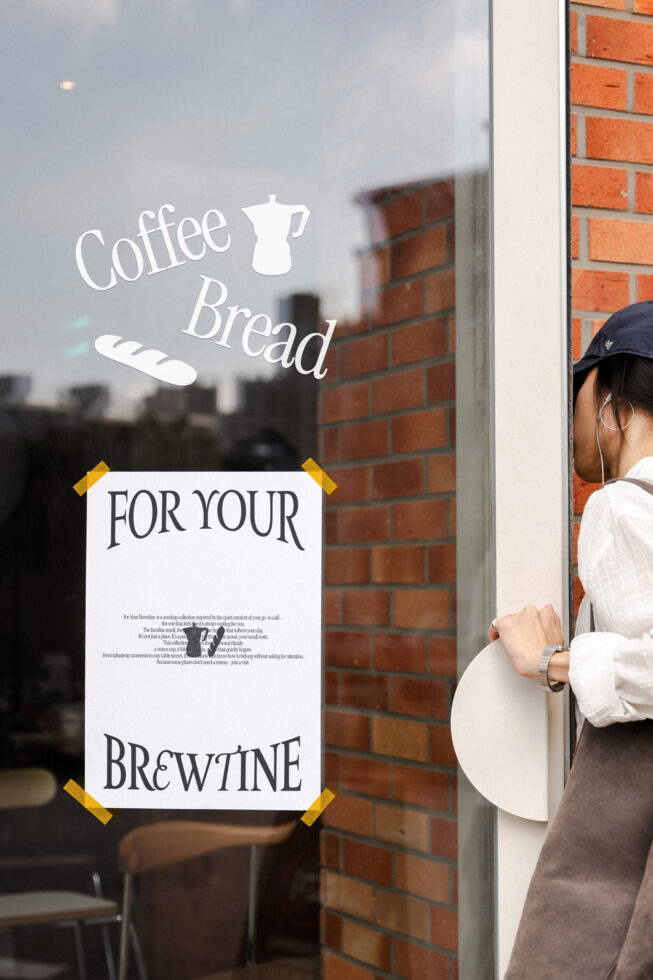 Storefront window decal showing Coffee Bread logo with masking tape corners